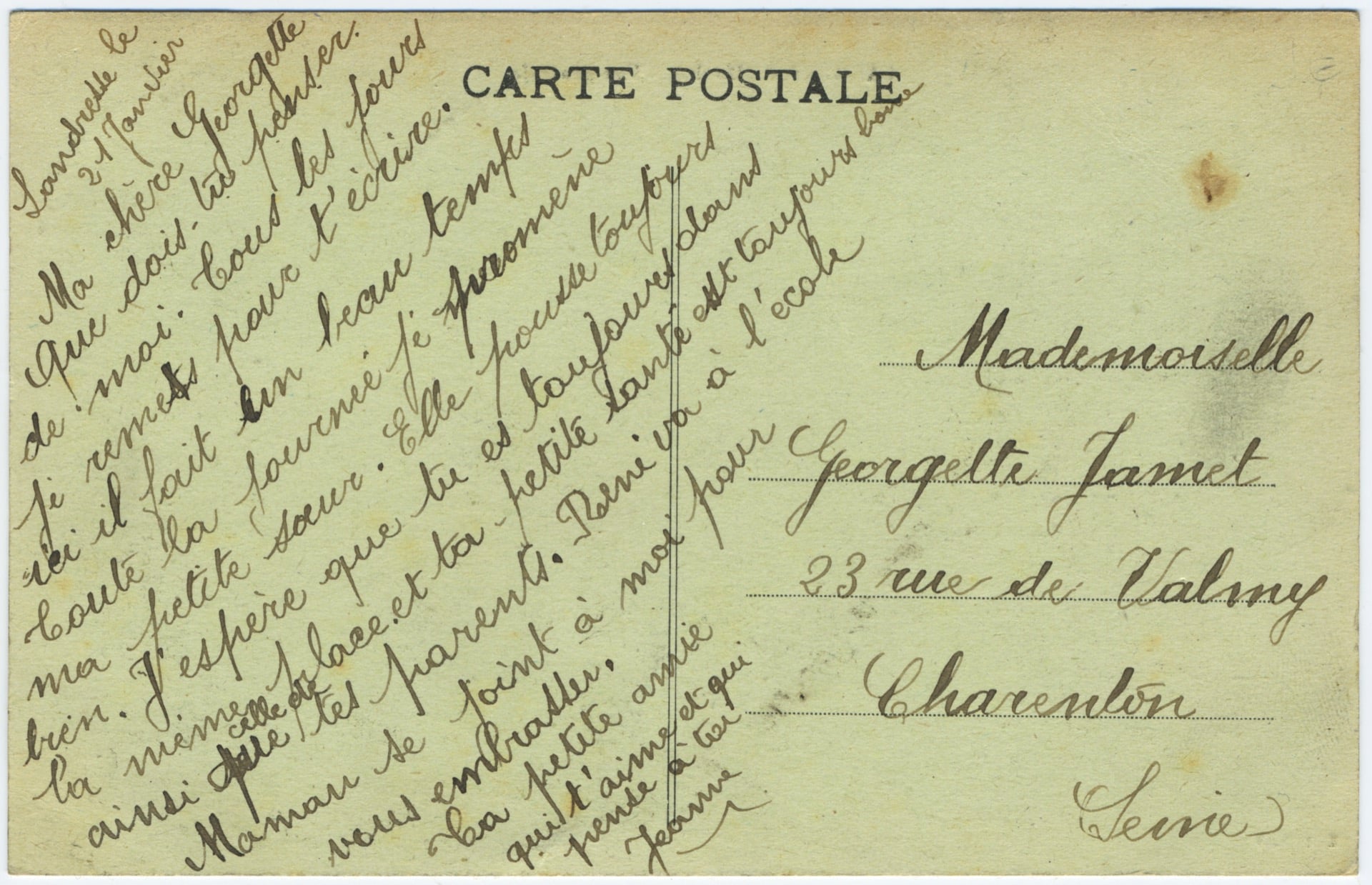 Verso d'une carte postale ancienne adressée à Charenton dans la Seine. Un message affectueux écrit en diagonale à l'encre brune donne des nouvelles d'enfants et mentionne le beau temps du mois de janvier à Landresse.