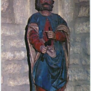 Photographie en couleur d'une statue en bois polychrome de Saint Pierre du XVIe siècle dans l'église de Landresse. Le saint porte une robe rouge, un manteau bleu et tient deux clés noires dans ses mains.